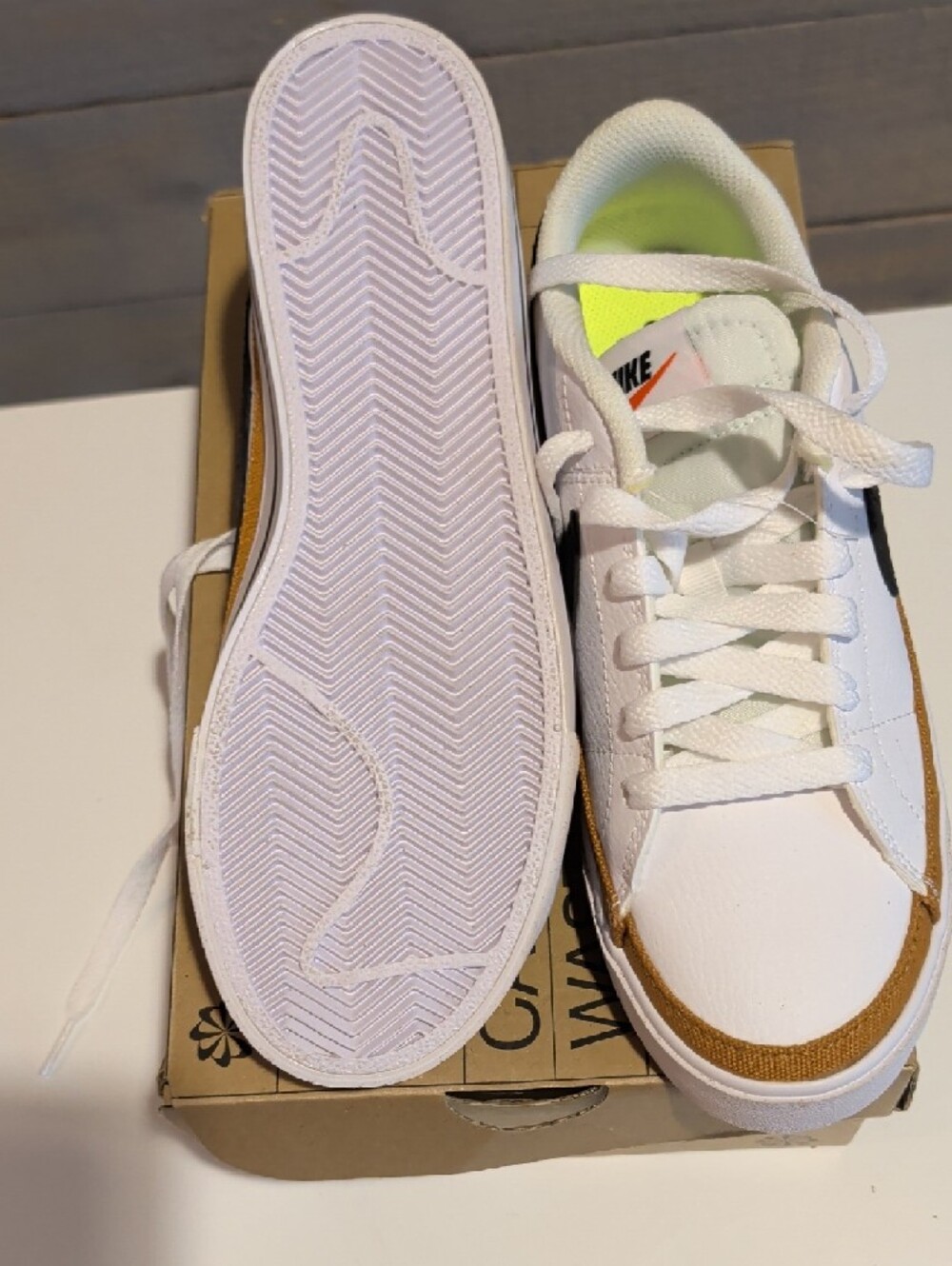 Nike White Sneakers with Black Swoosh and Brown Accent - Picture 3 of 4